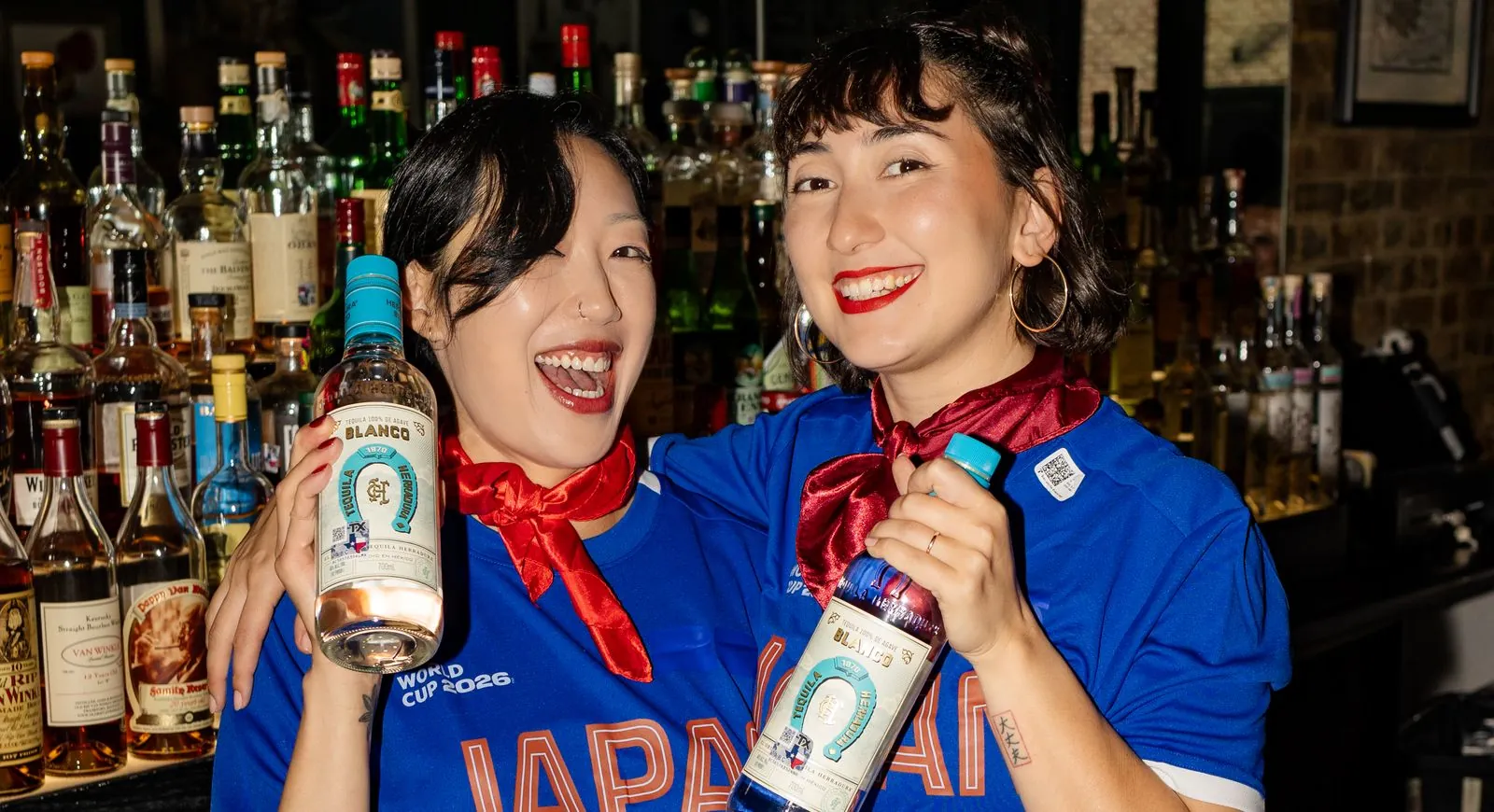 Brand ambassadors holding Tequila Herradura bottles at a Green House pop-up brand activation.