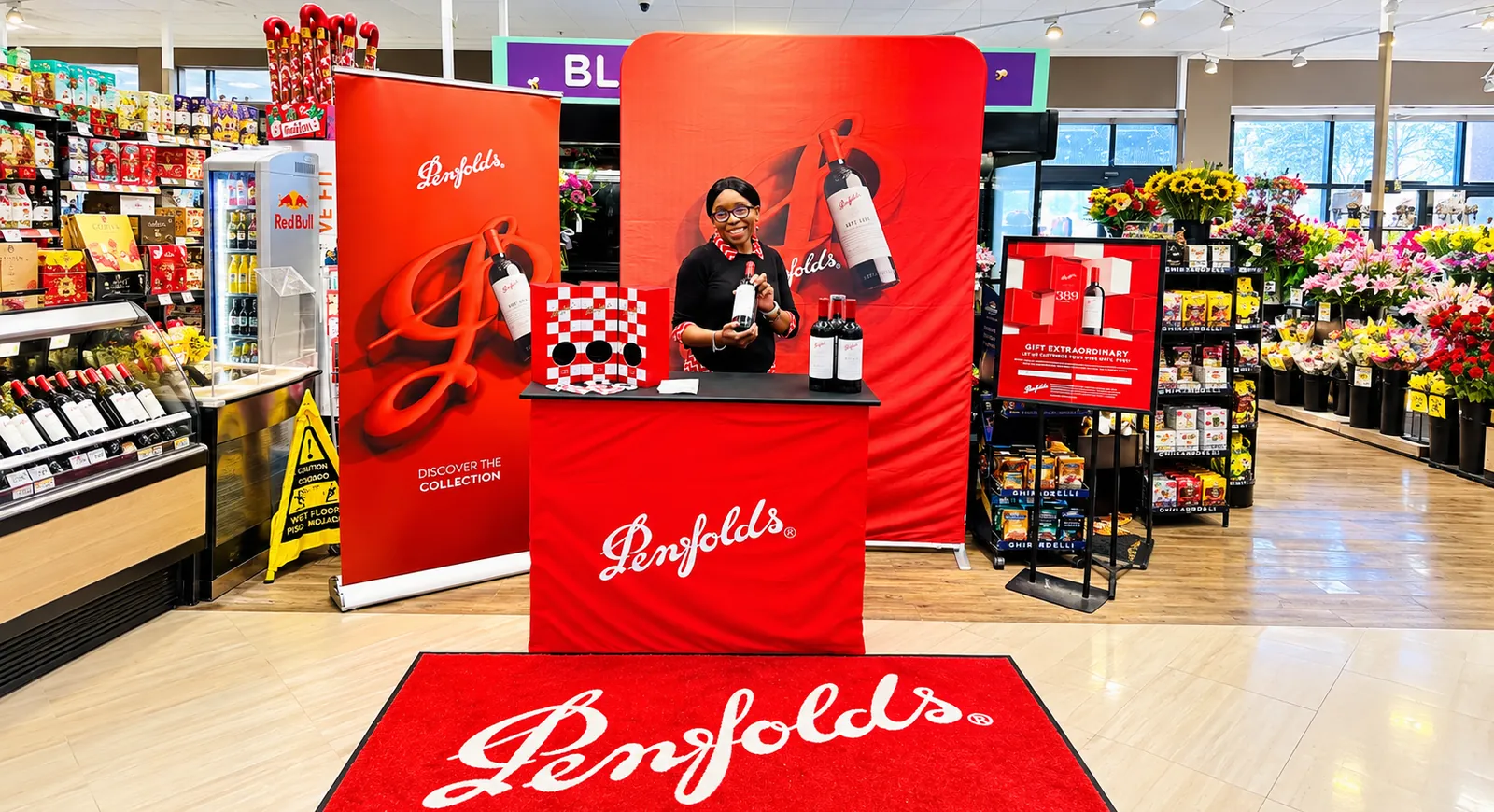 Green House brand ambassador hosting a Penfolds in-store activation with a premium gifting display.