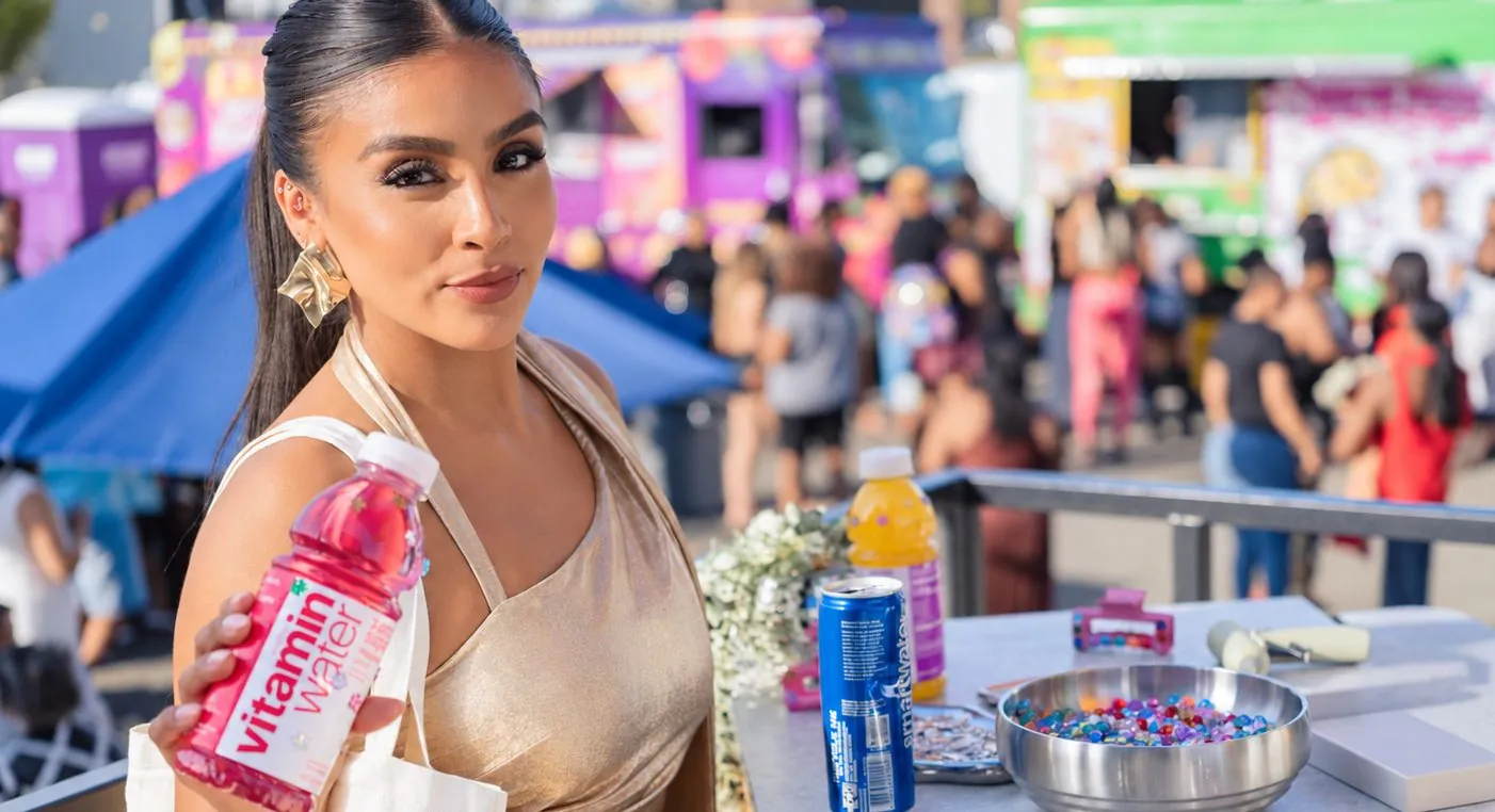 Guest holding vitaminwater at a Green House brand activation during New York Fashion Week.